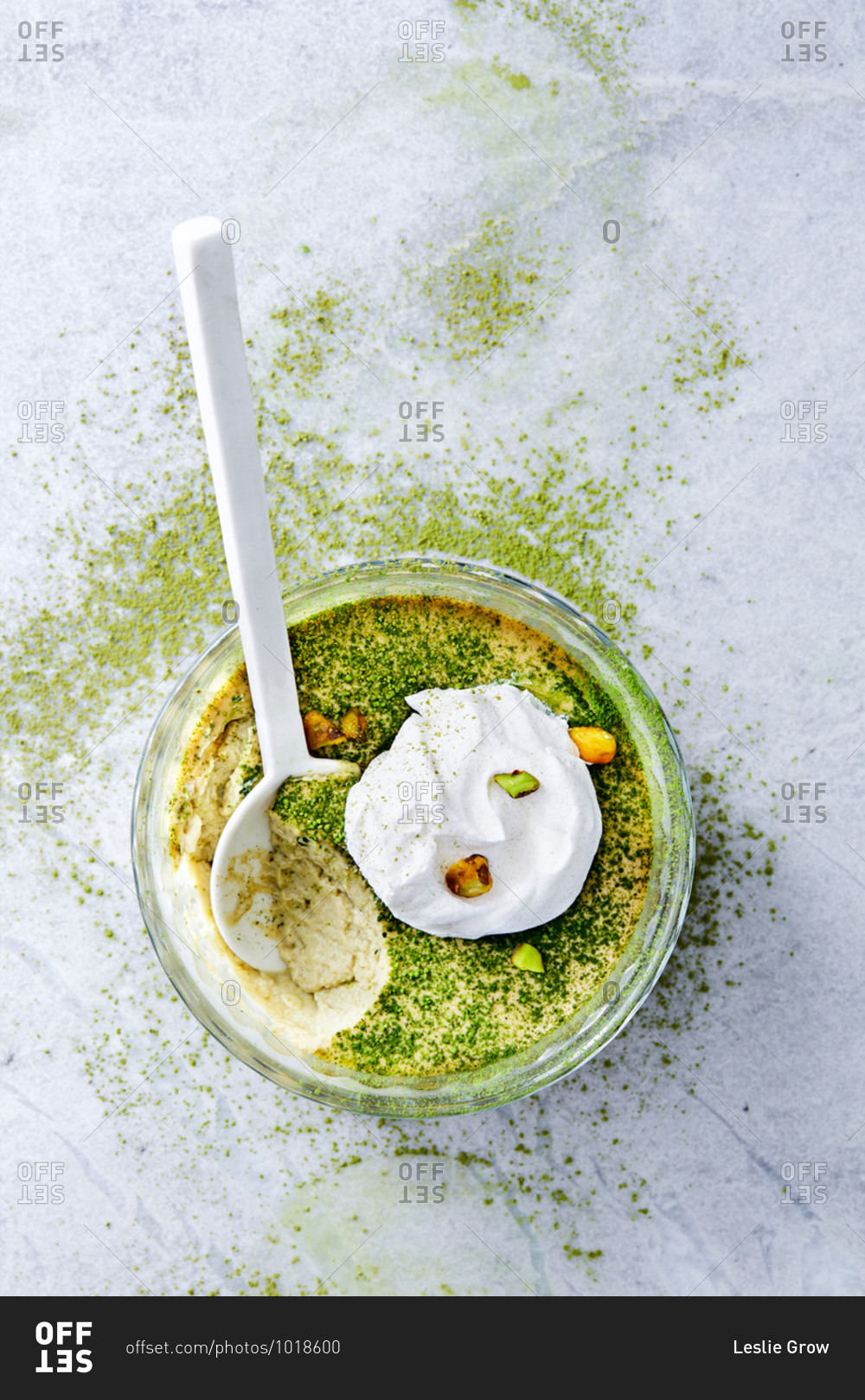 Green tea coconut milk custard topped with whipped cream and pistachios