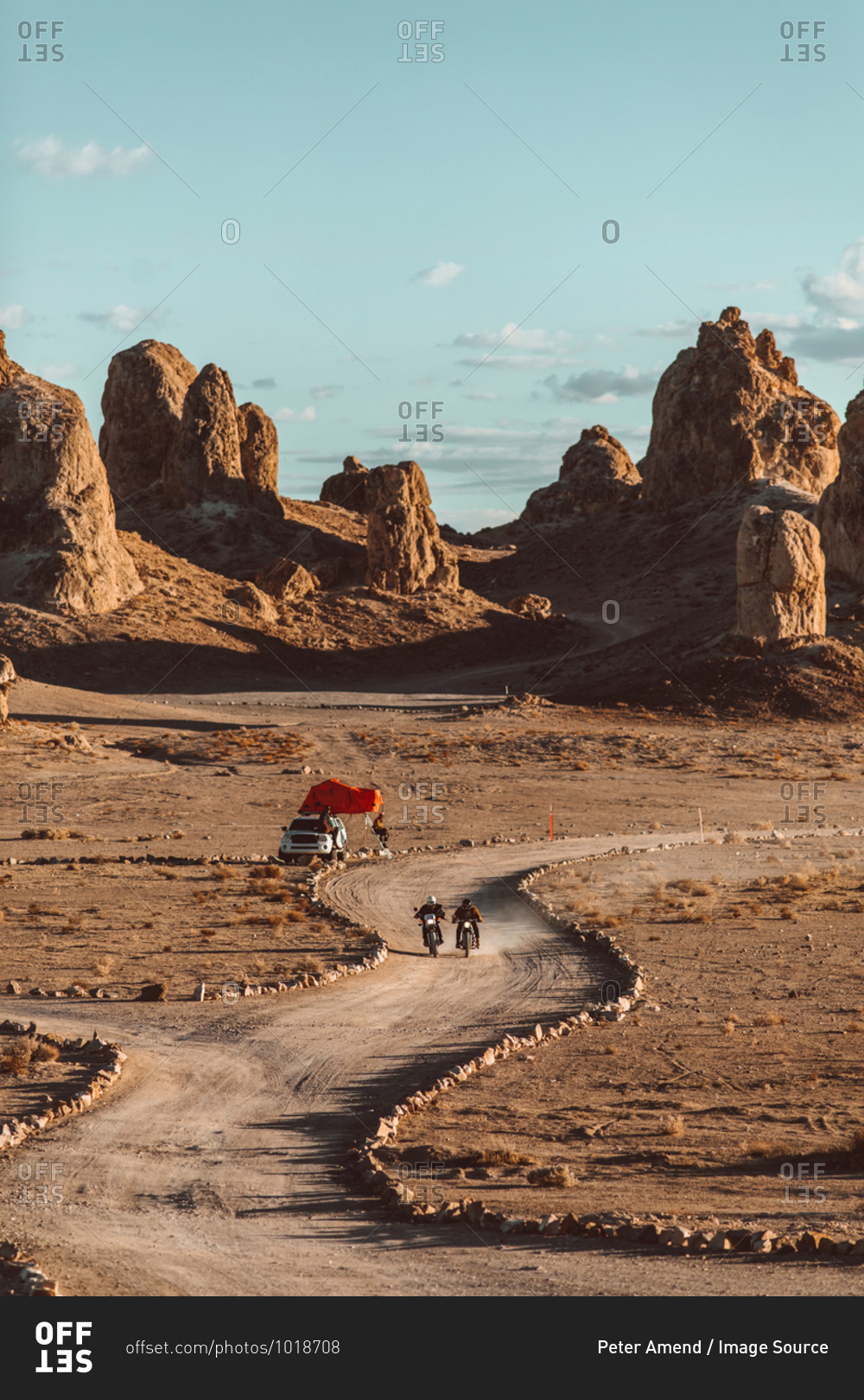 Motorcyclist friends riding in desert, Trona Pinnacles, California, US