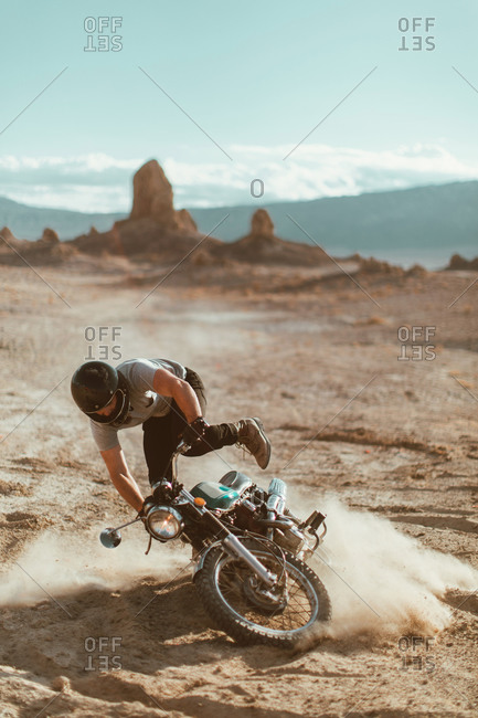Motorcyclist enjoying stunts, Trona Pinnacles, California, US
