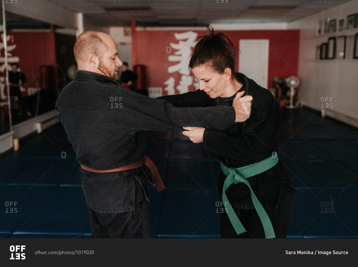 Couple practicing martial arts in studio