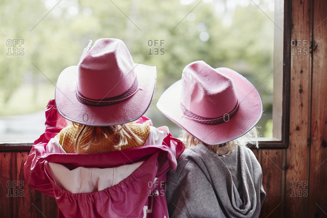 Girl wearing pink cowboy hats