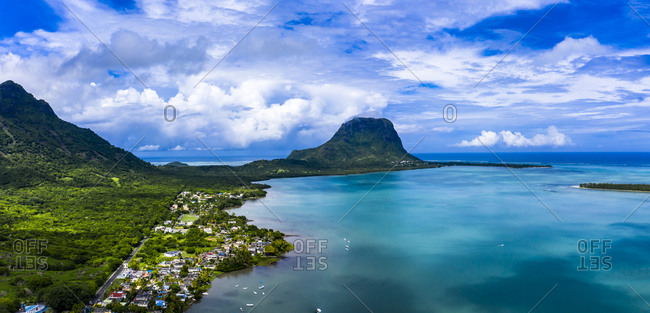 Mauritius- Black River- Tamarin- Helicopter view of coastal village with Le Morne Brabant mountain in background