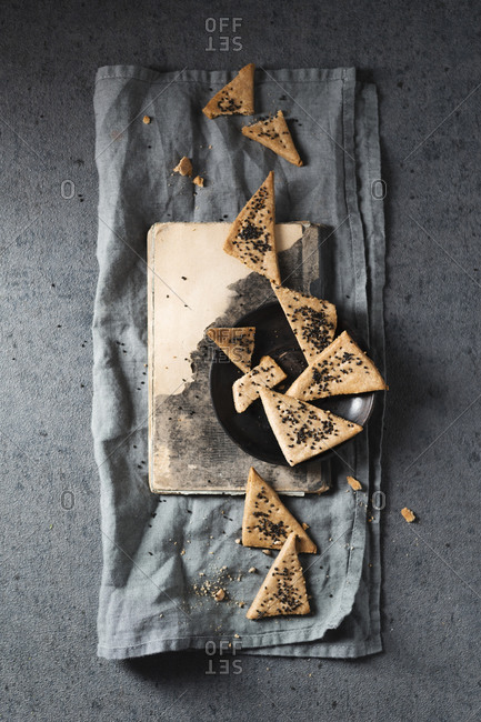 Studio shot of homemade sourdough crackers with basil seeds