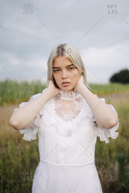 Young woman in white dress in nature