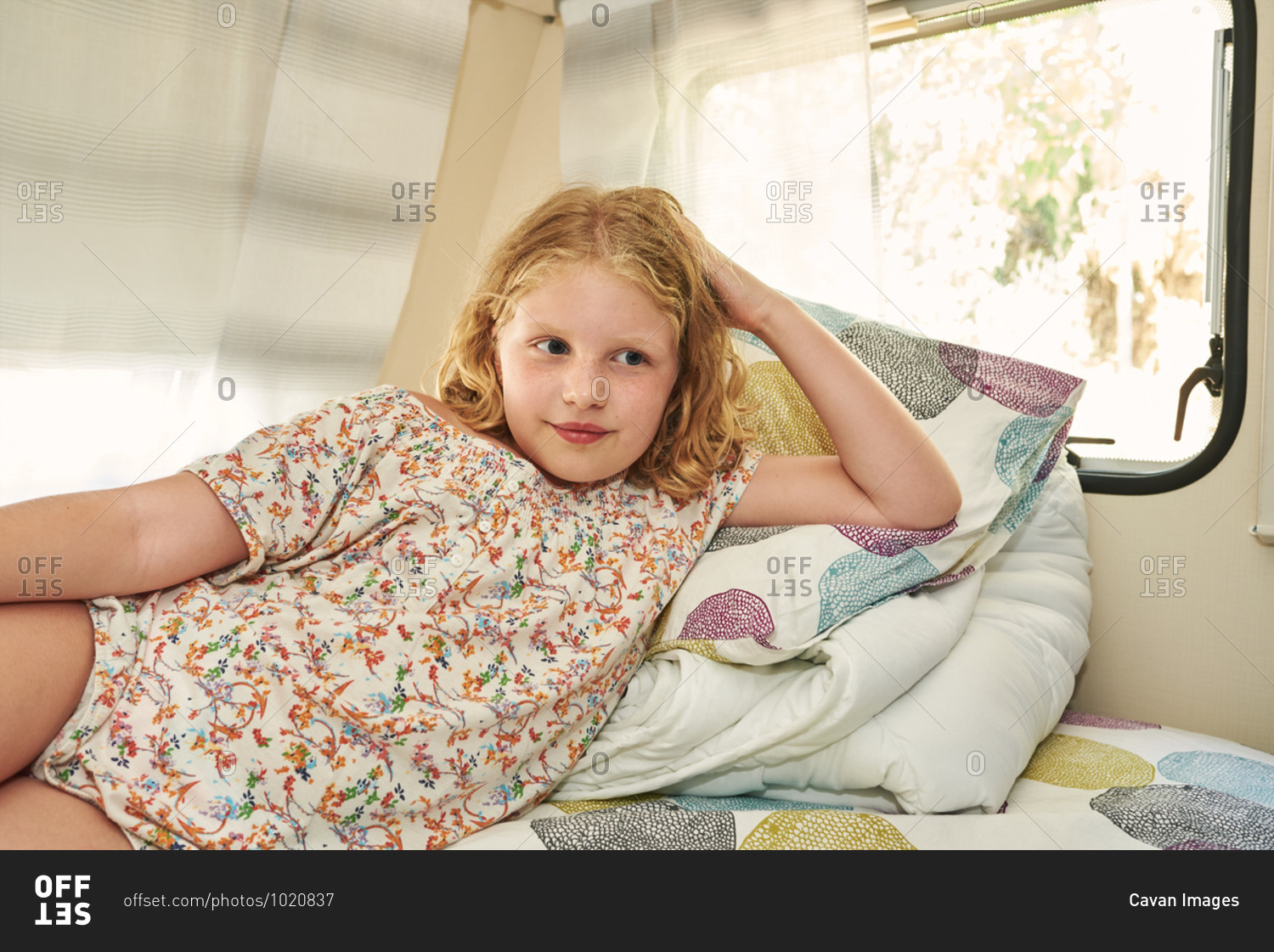 Girl lying in a caravan. she is relaxed on her vacation.