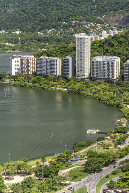 View to residential buildings in lagoa and green forested mountains