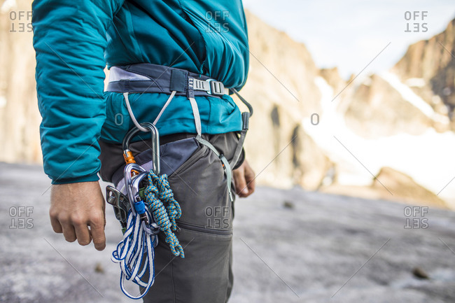 Side view of climbers harness and safety gear.