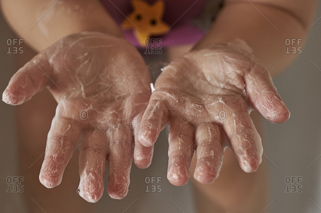 Kid hands in soapy foam. the concept of hand washing, hygiene. pandemic protection. prevention