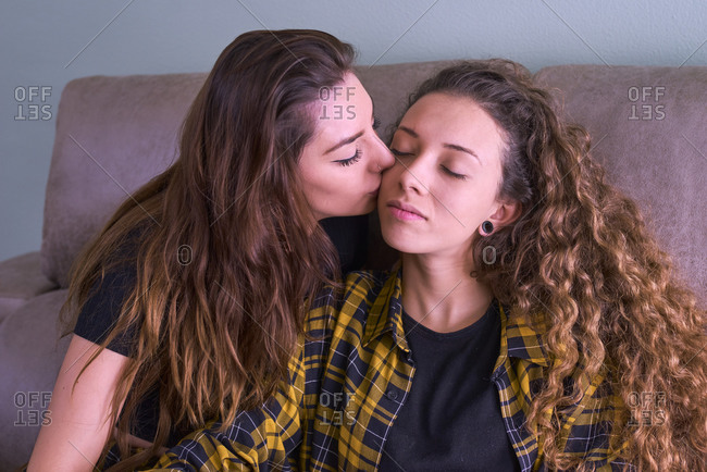 Lesbians Kissing On Couch