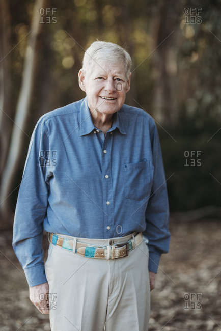 Portrait of senior adult male smiling in forest