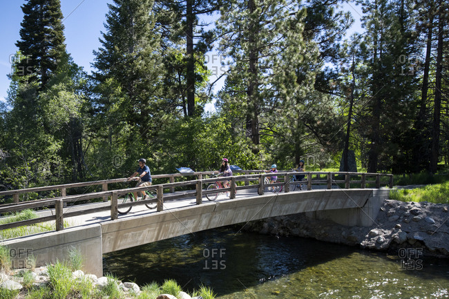 A family enjoys a bike ride on a bike path in south lake tahoe, ca