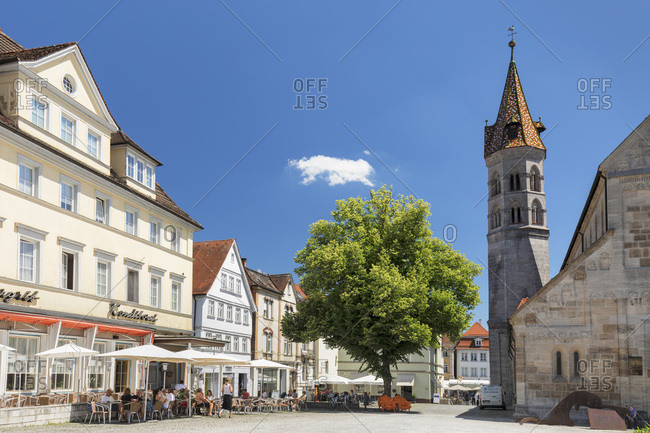 June 19, 2019: Street cafe at Johannisplatz square, Johanniskirche church, Schwaebisch-Gmund, Baden-Wurttemberg, Germany, Europe