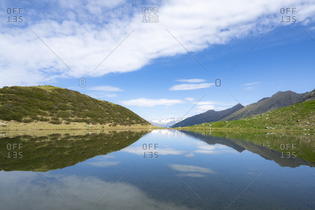 Mountains reflected in the blue water of Porcile Lakes, Tartano Valley, Valtellina, Sondrio province, Lombardy, Italy, Europe