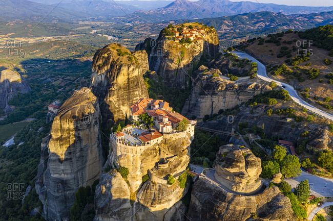 Aerial by drone of the Holy Monastery of Varlaam at sunrise, UNESCO World Heritage Site, Meteora Monasteries, Greece, Europe