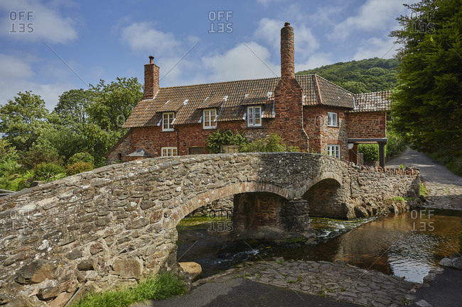 The packhorse bridge and old cottages in the village of Allerford, Exmoor National Park, Somerset, England, United Kingdom, Europe