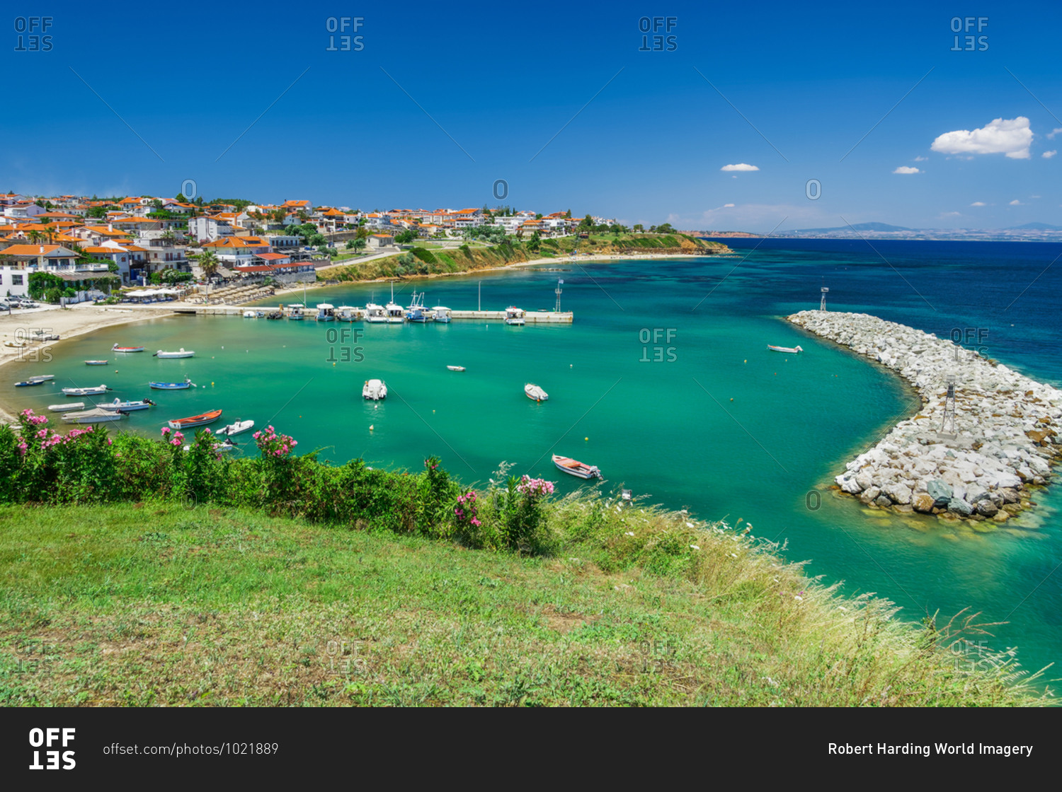 Coastal village with fishing port, hilltop view of Nea Fokaia at Kassandra peninsula with low rise buildings, Chalkidiki, Greece, Europe