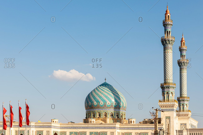 February 28, 2018: Exterior view of an oriental Mosque with decorative tiles and a dome in Qom, Iran
