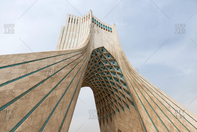 March 11, 2018: The modern Azadi tower on a gray cloudy day in Tehran, Iran  stock photo - OFFSET