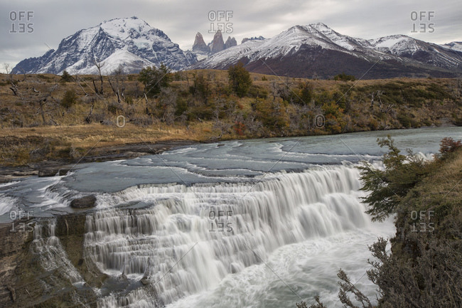 View over Paine Cascades and distant mountains, Torres Del Paine National Park, Chile