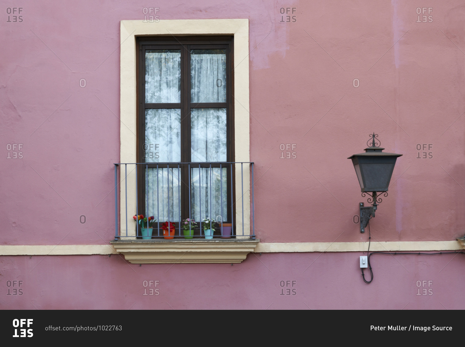 Detail of traditional pink painted house exterior, Seville, Andalusia, Spain