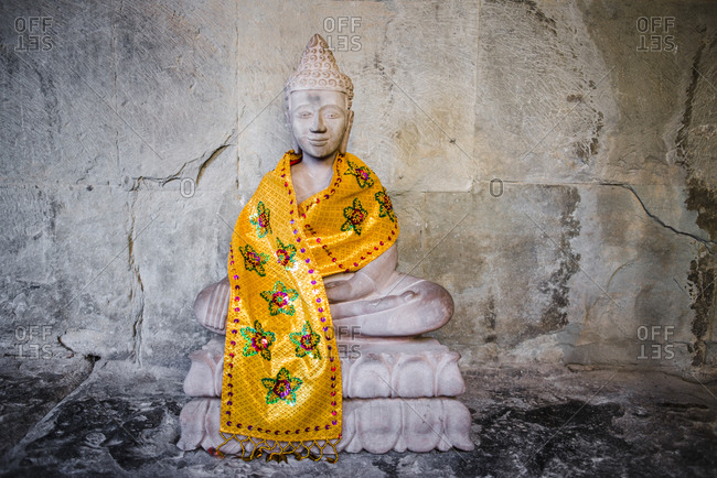 Buddhist statue with golden sash, Angkor Wat, Cambodia