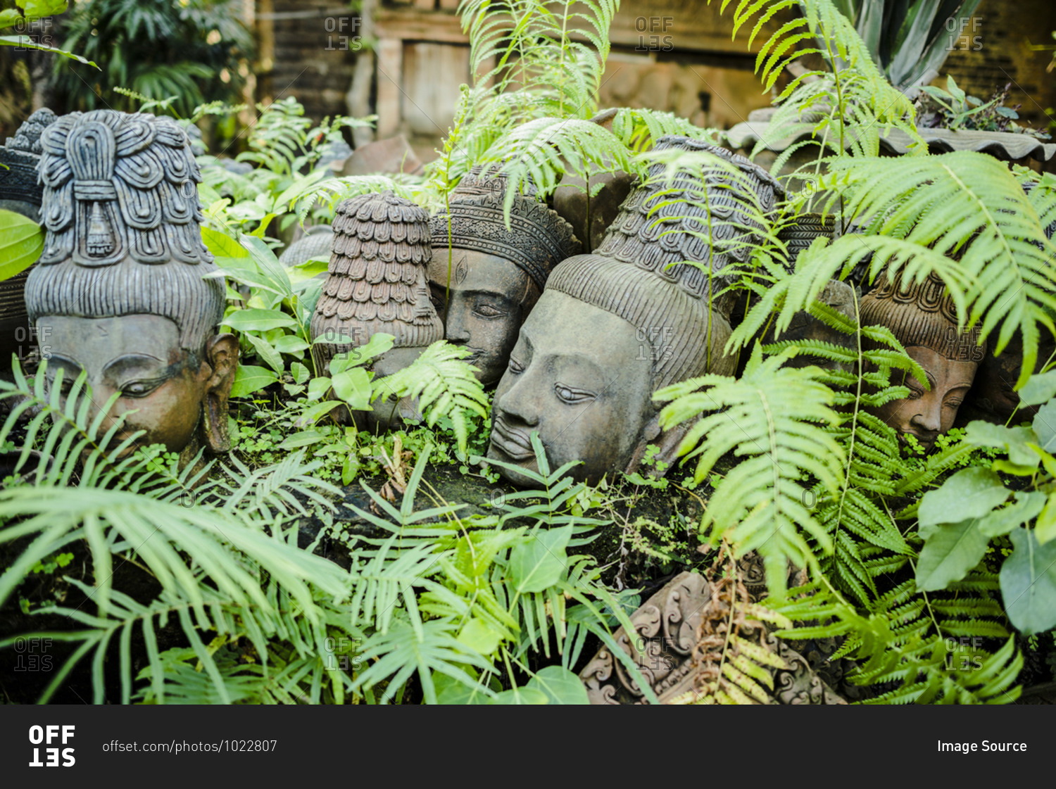 Terracotta head sculptures in garden at Clay Studio Coffee In The Garden, Chiang Mai, Thailand