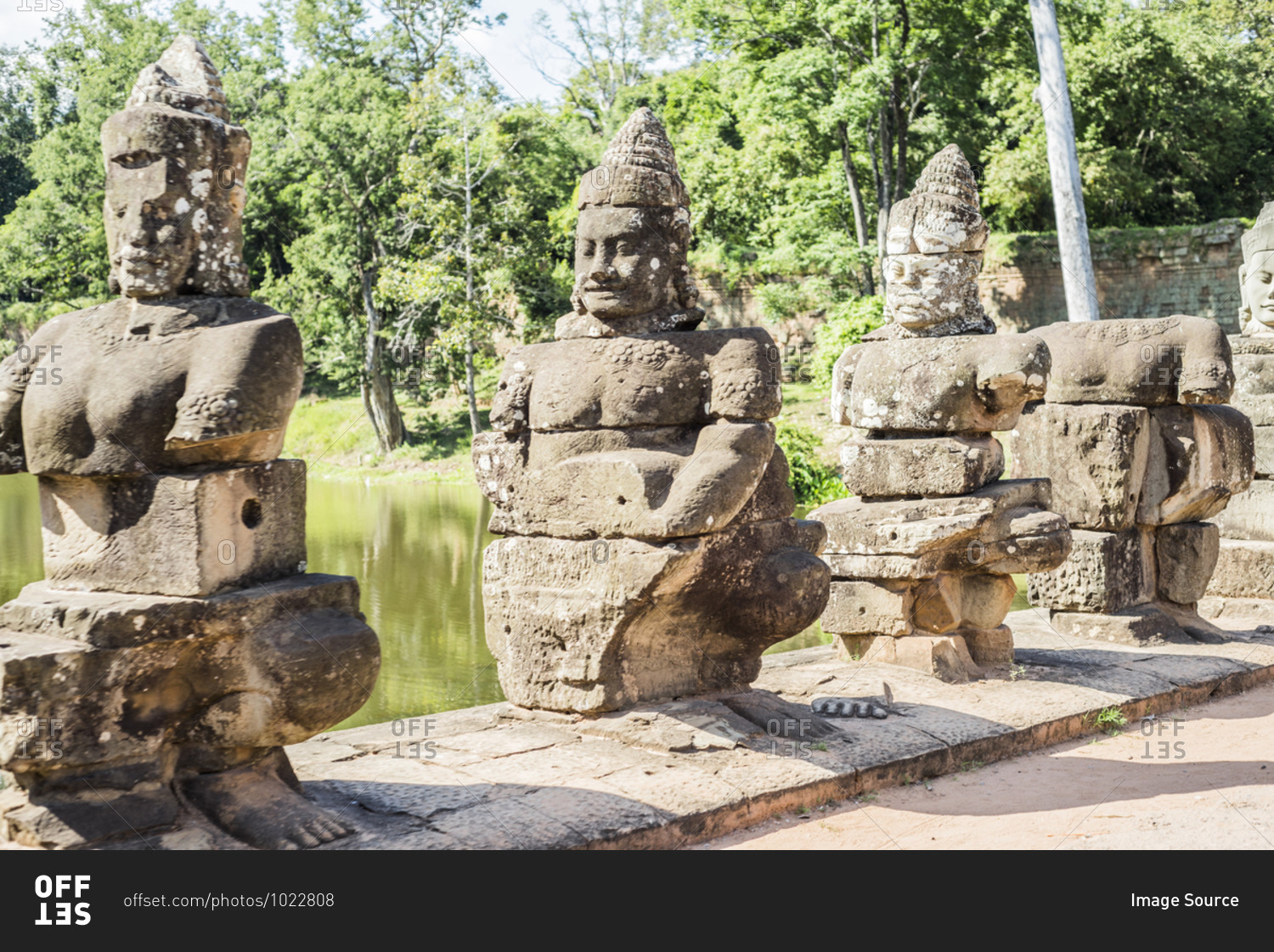 Row of lakeside statues at Phimeanakas temple, Ta Phom, Angkor Thom, Cambodia