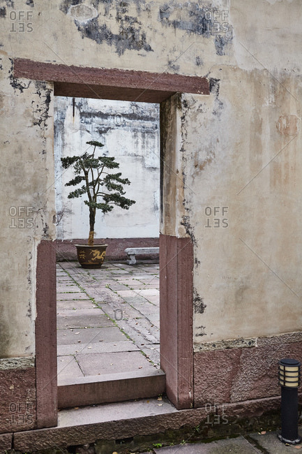 Doorway and courtyard in Baguo temple complex, Ningbo, Zhejiang, China