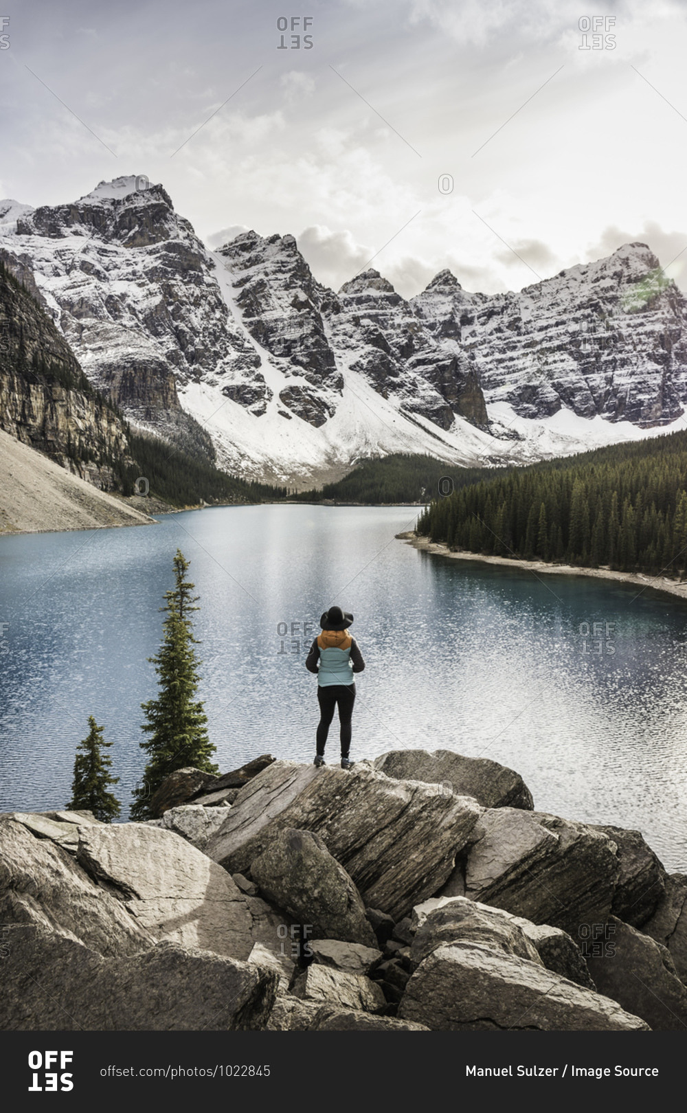Woman standing, looking at view, Moraine Lake, Lake Louise, Alberta, Canada