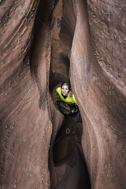 Woman exploring slot canyon Grand Staircase-Escalante National Monument, Utah, USA
