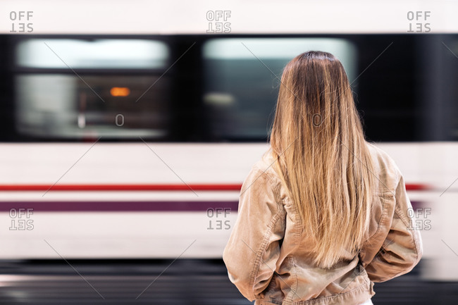 Unrecognized woman standing in the train platform