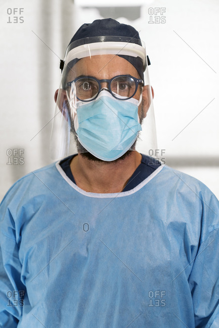 Portrait of a dental surgeon dressed in full protective gear