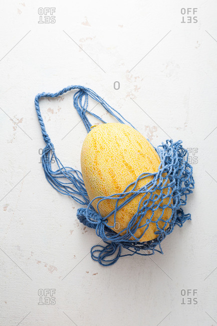 One melon in blue string eco bag