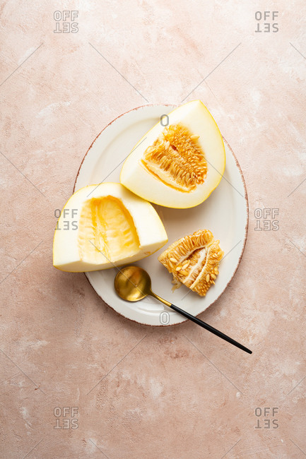 Ripe melon sliced on plate form above