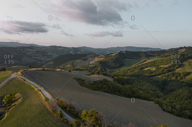 Sunset sky over hills and farmland in rural Marche, Italy