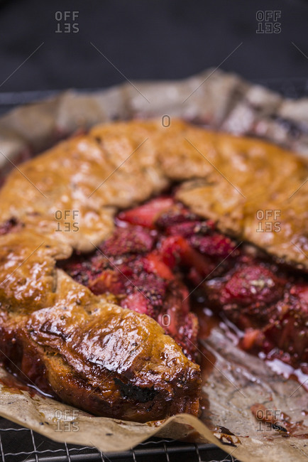 Close up of a fresh baked strawberry galette with vanilla bean and chia seeds