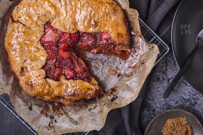 Overhead view of a fresh baked strawberry galette with vanilla bean and chia seeds