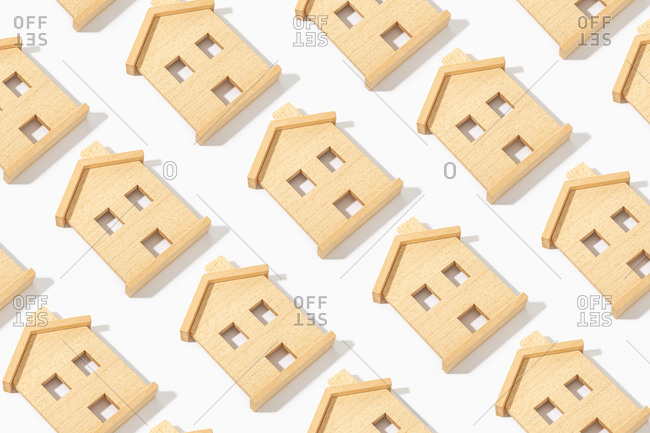 Pattern of Wooden house model on white background. Real estate concept background