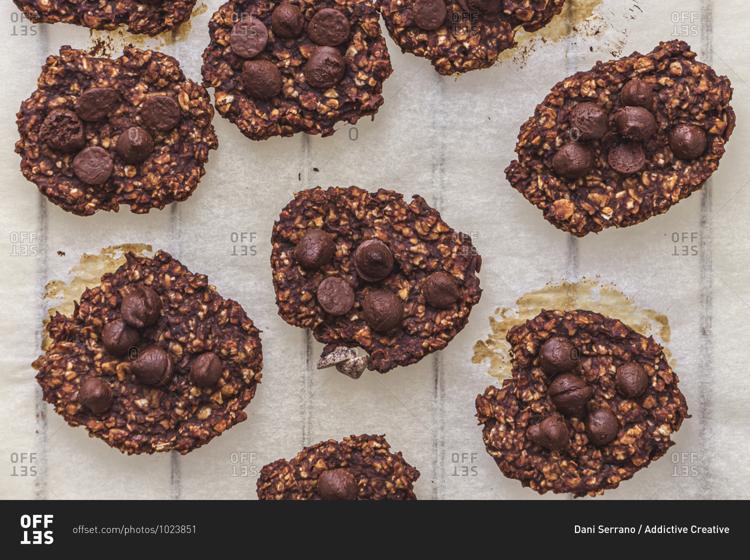 Top shot of oatmeal and banana cookies with chocolate chips on a tray