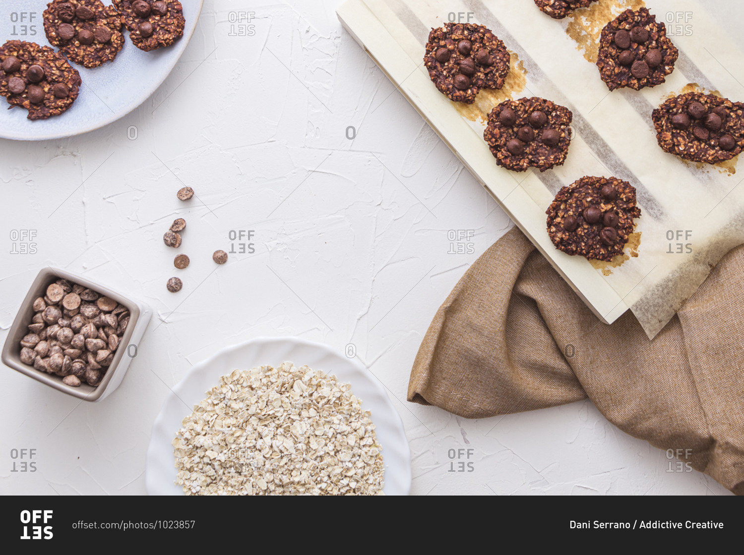 Overhead shot of freshly baked oatmeal and banana cookies with chocolate chips with some copy space.