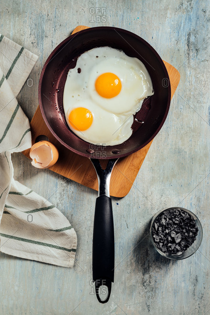 Fried egg. view of two fried eggs on a frying pan. ready to eat with breakfast or lunch