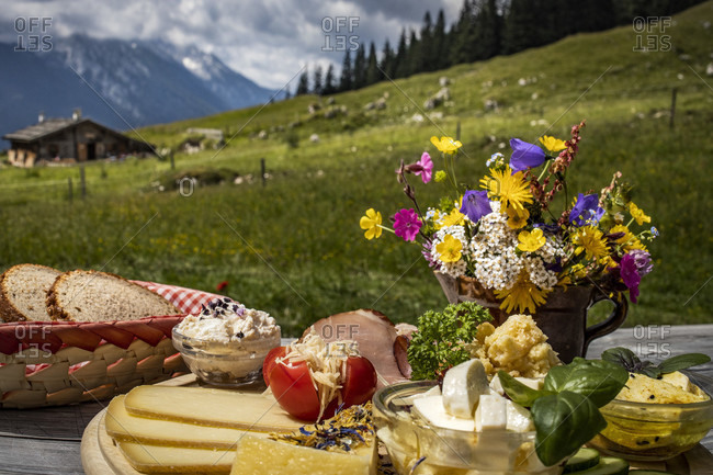 Quaint mountain pasture in the Alps, snack on the terrace, Berchtesgadener Land, Bavaria, Germany