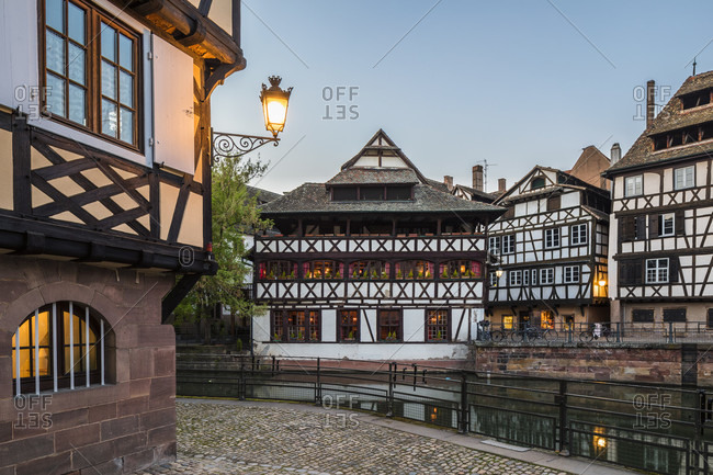 Half-timbered houses at the tanners quarter by River Ill, sunset, Petite France, Old City, Strassbourg, Elsass, Grand Est Region, France