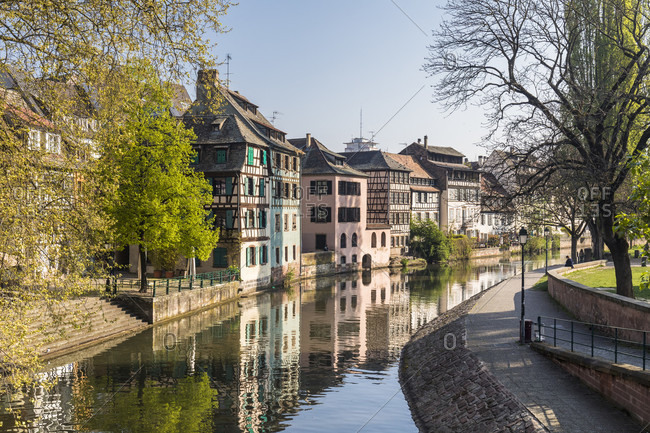 Half-timbered houses reflecting in River Ille, Petite France, Old City, Strasbourg, Elsass, Grand Est Region, France