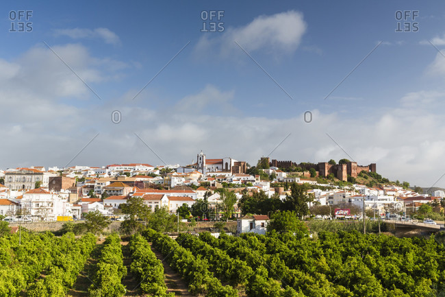 View on the hilltop city of Silves with the church and castle