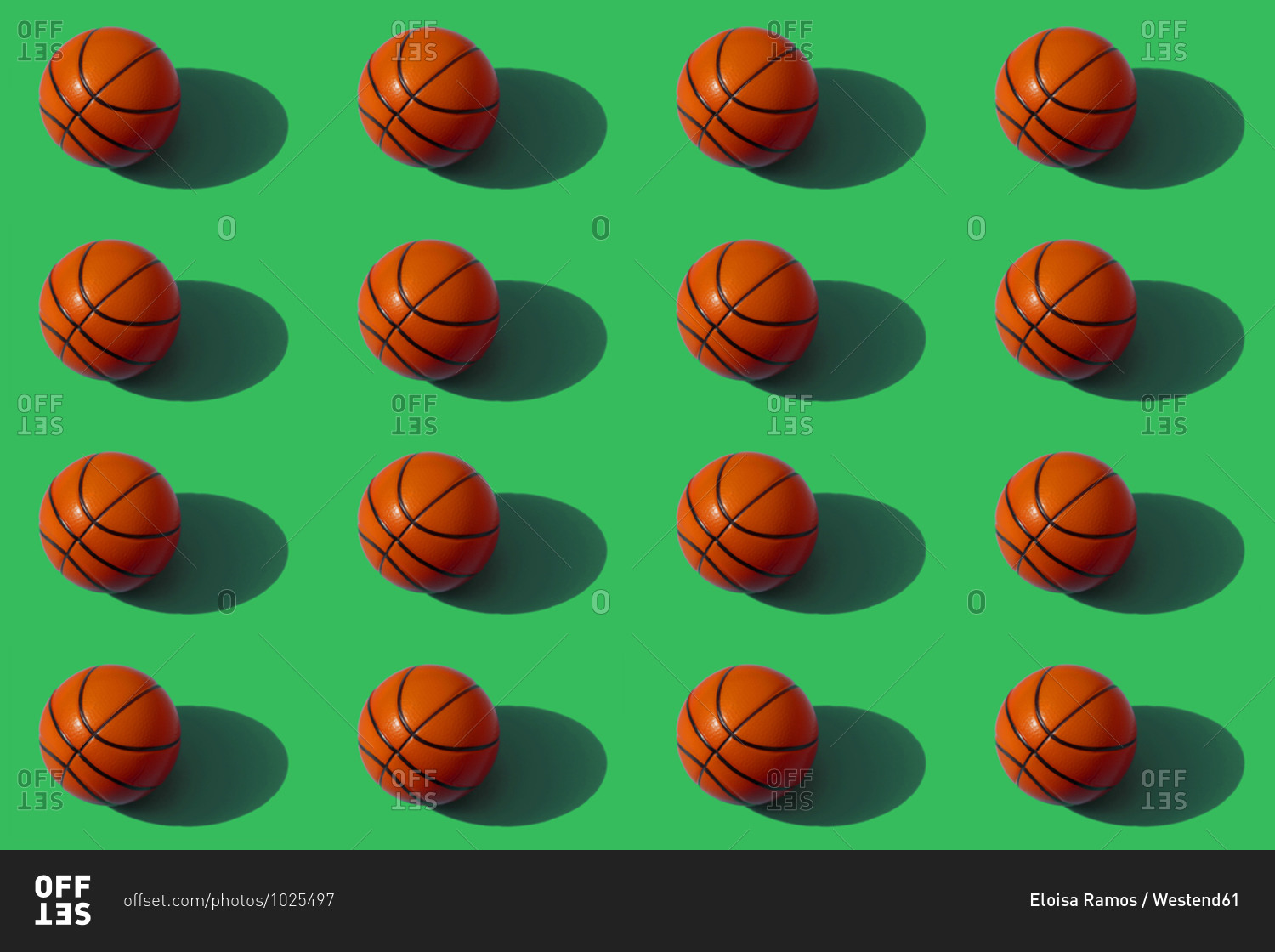 Pattern of basketballs against green background