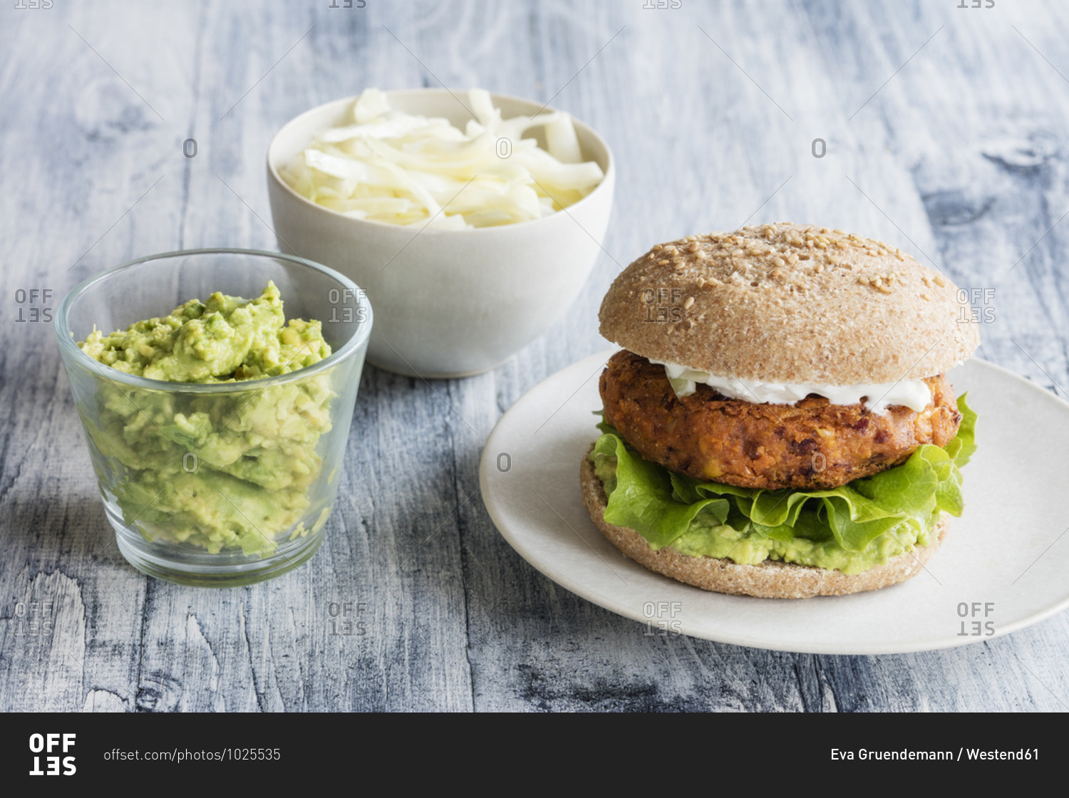 Bean and corn veggie burger with separate salads
