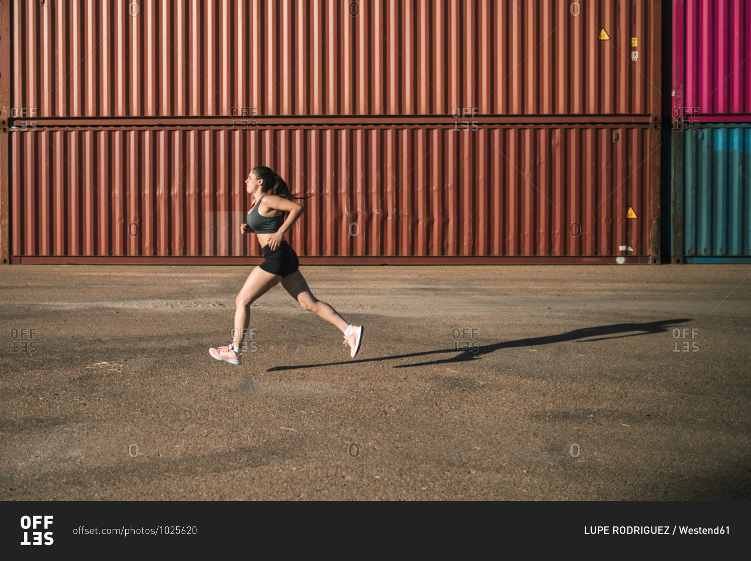 Woman jogging in an industrial park