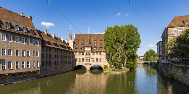 Germany- Bavaria- Nuremberg- Panorama of river Pegnitz and Holy Spirit Hospital
