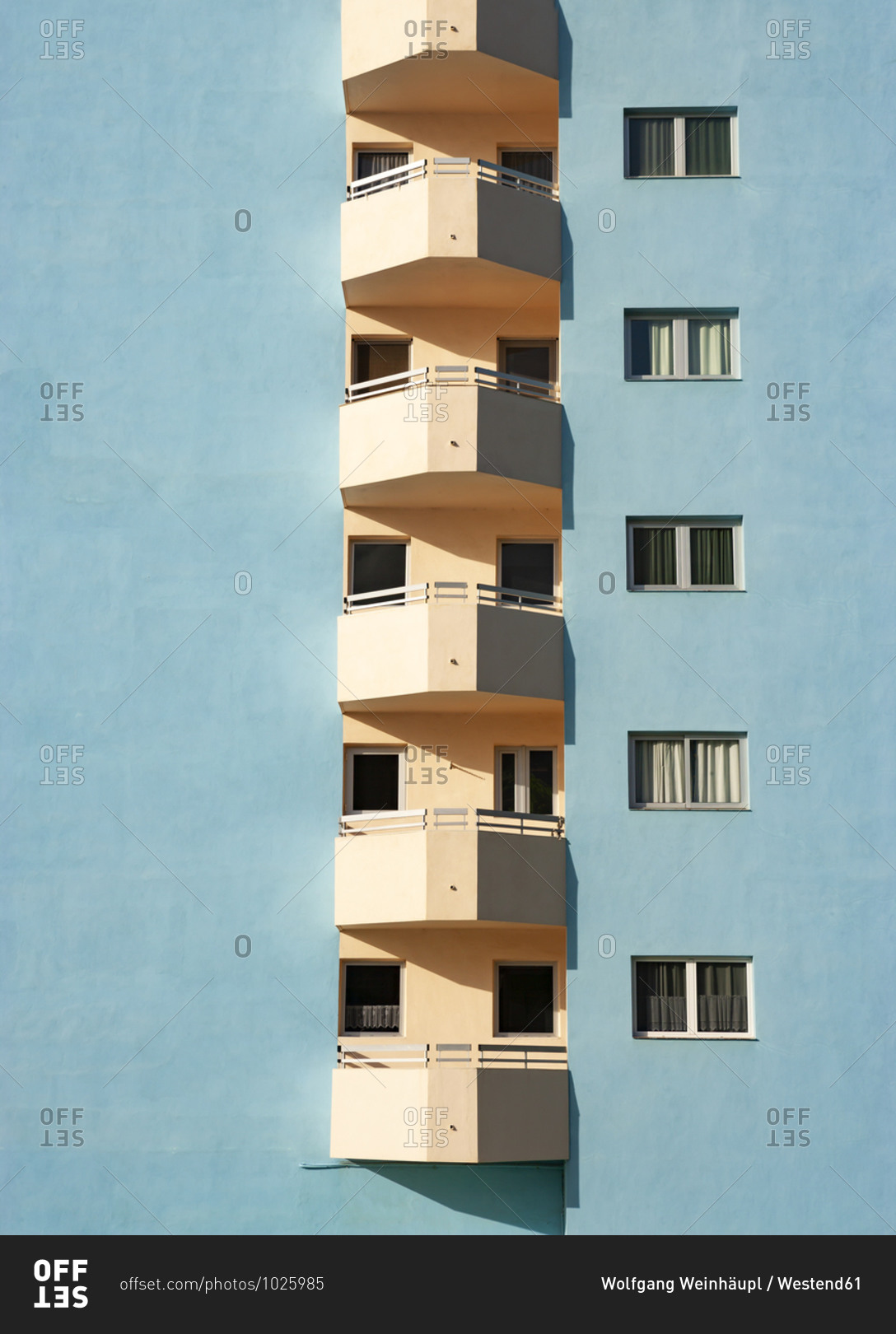 Balconies of pastel blue colored hotel